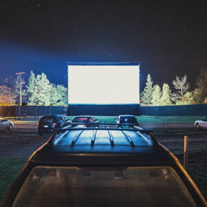 istockphoto-187250480-612x612 Drive in movie goers enjoy a screening under clear Autumn skies. Long exposure.